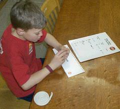 boy working at table