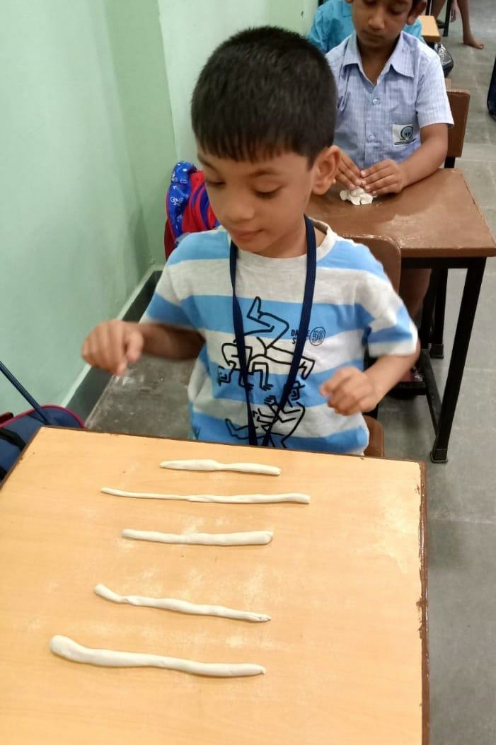 Child working with clay